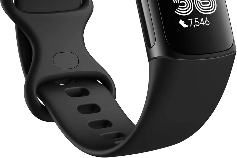 Close-up of a fitness tracker showing heart rate and step data