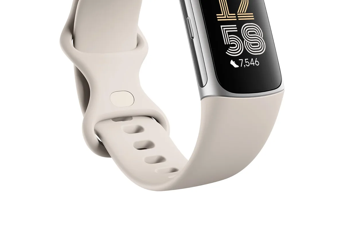 A fitness tracker on a wrist at the gym