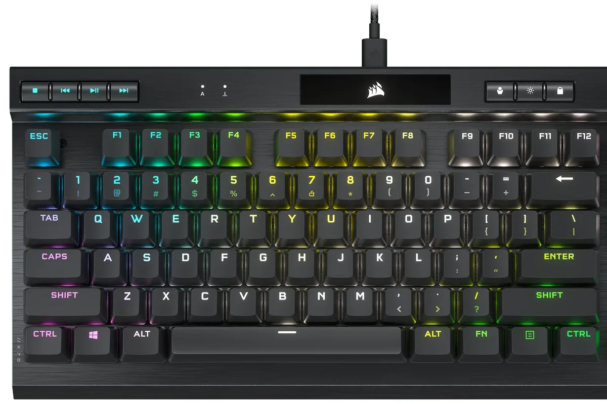 A mechanical gaming keyboard with RGB backlighting on a desk