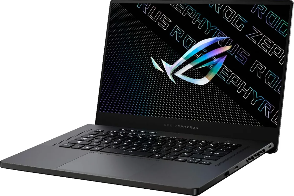 A gaming laptop with RGB keyboard lighting on a gaming desk