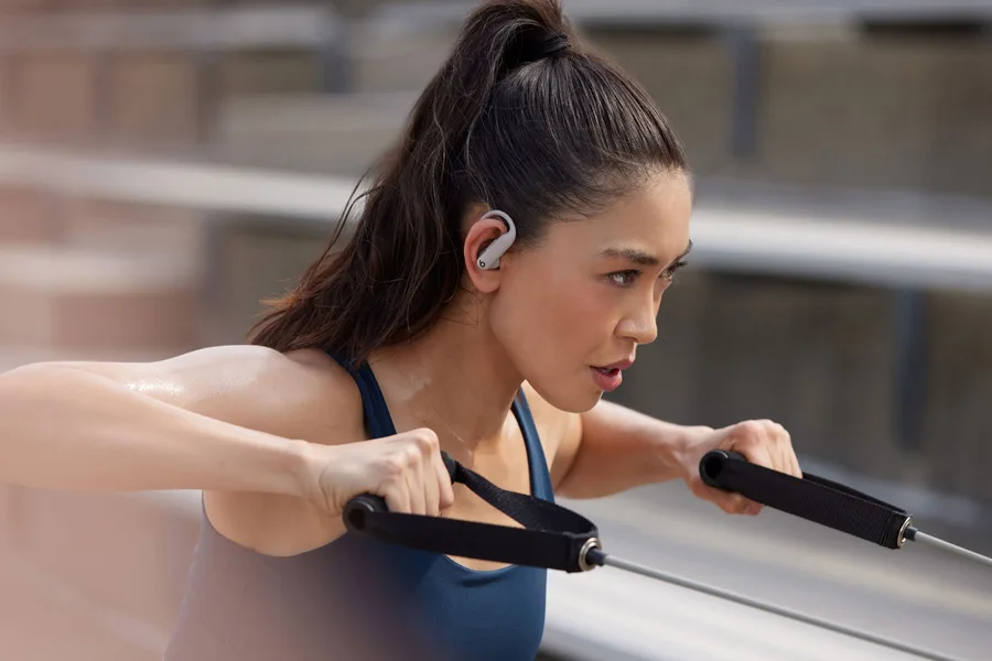 Runner wearing earbuds during a morning run
