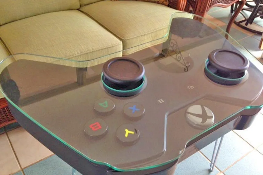 Hands holding a wireless controller while playing on a TV