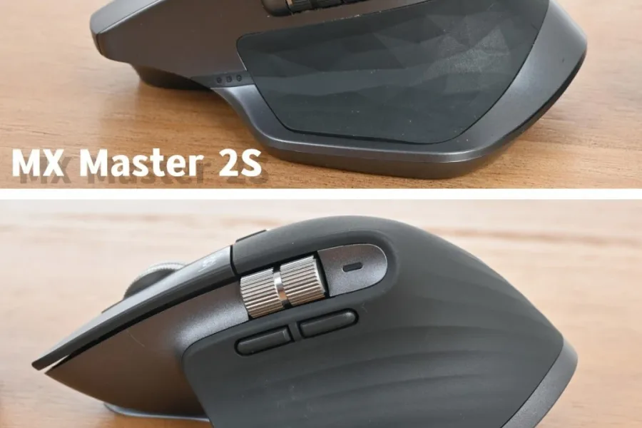Hand using a wireless mouse with a scroll wheel in close-up